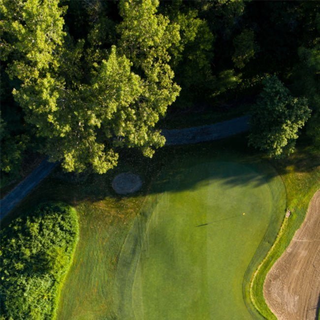 Aerial view of a wooded golf course