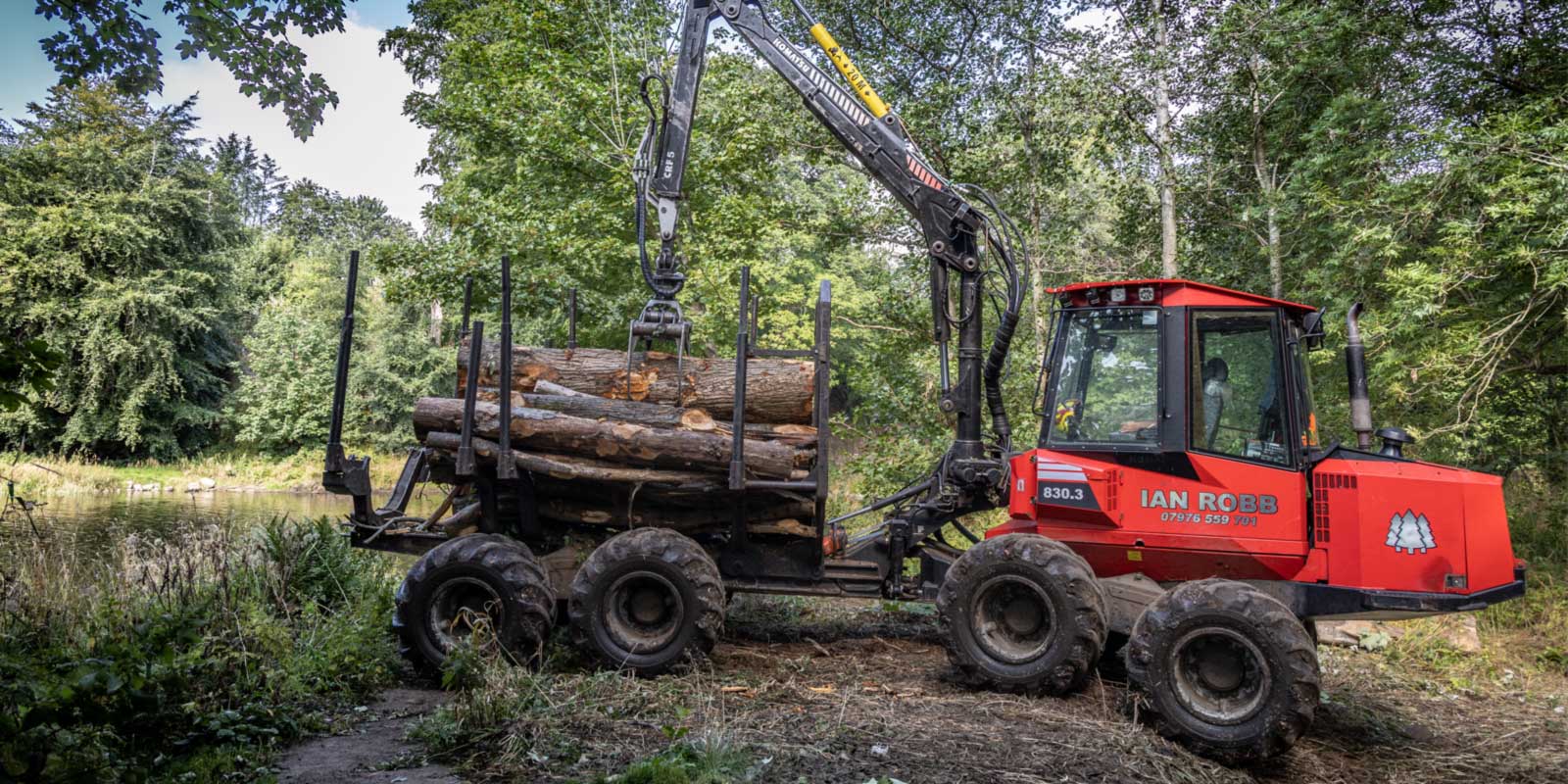 Timber forwarder working in confined location near Aberdeen